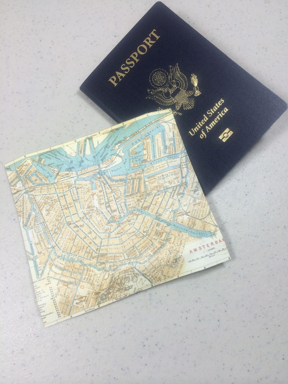 Cut an accent paper to create a passport pocket 5" wide x 4 1/2" high.