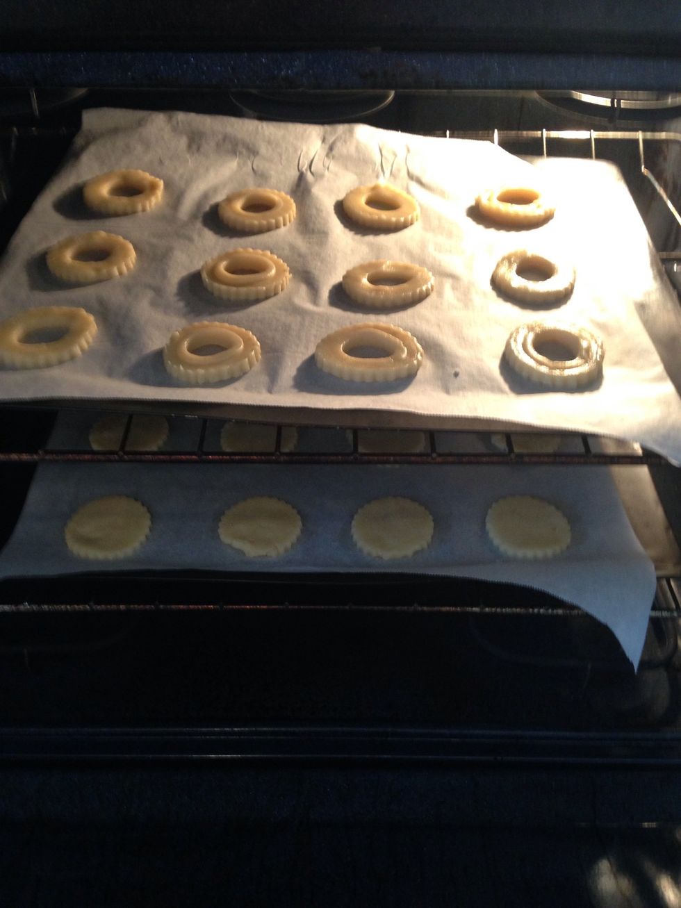 Cut an equal amount of tops (with holes) and bottoms. Place all tops on 1 cookie sheet and all bottoms on the other. Bake 8-10 minutes or until golden brown on the edges.