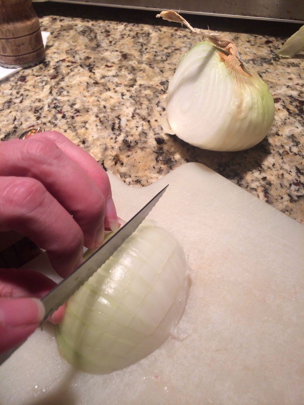 Cut an onion in half and slice it up into bits