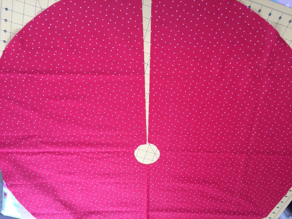 Cut an opening from outer circle to neck in main piece and batting