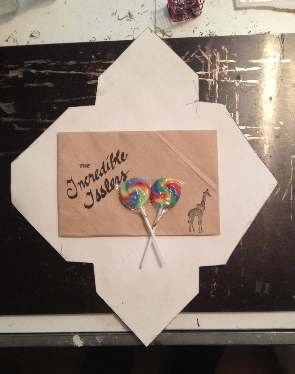 Cut and glue your own envelopes using a template (I made mine) and paper grocery bags.