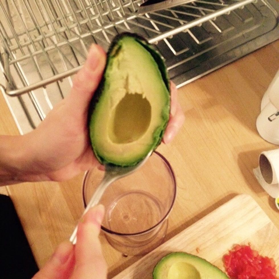 Cut and pit the avocados. Scoop them in a bowl where you will blend them or the food processor.