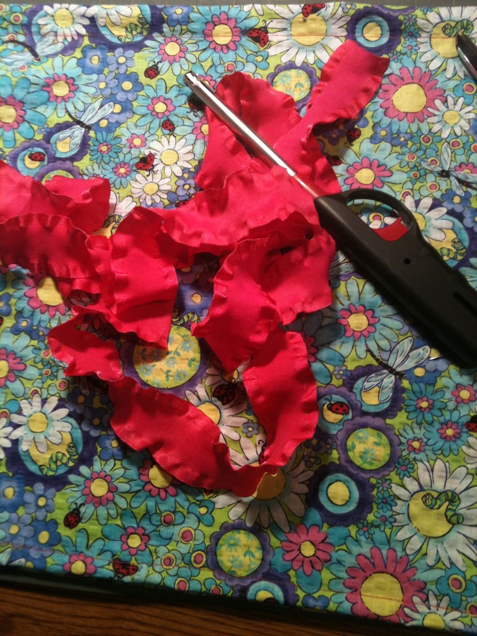 Cut and seal 2 pieces of ribbon- each about a yard long.