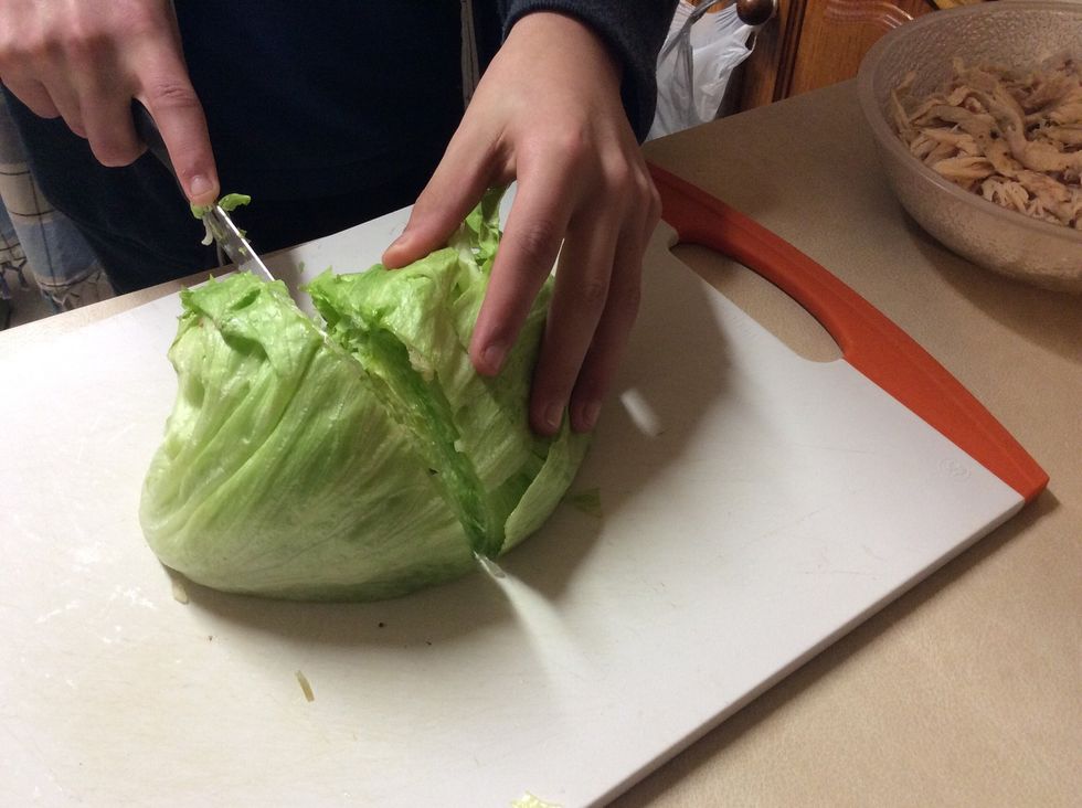 Cut and shred iceberg lettuce. Put chicken and lettuce to the side for now