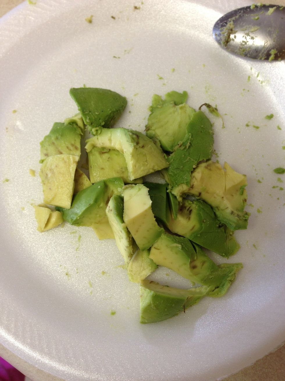 Cut and take the pulp of avocado out and dice