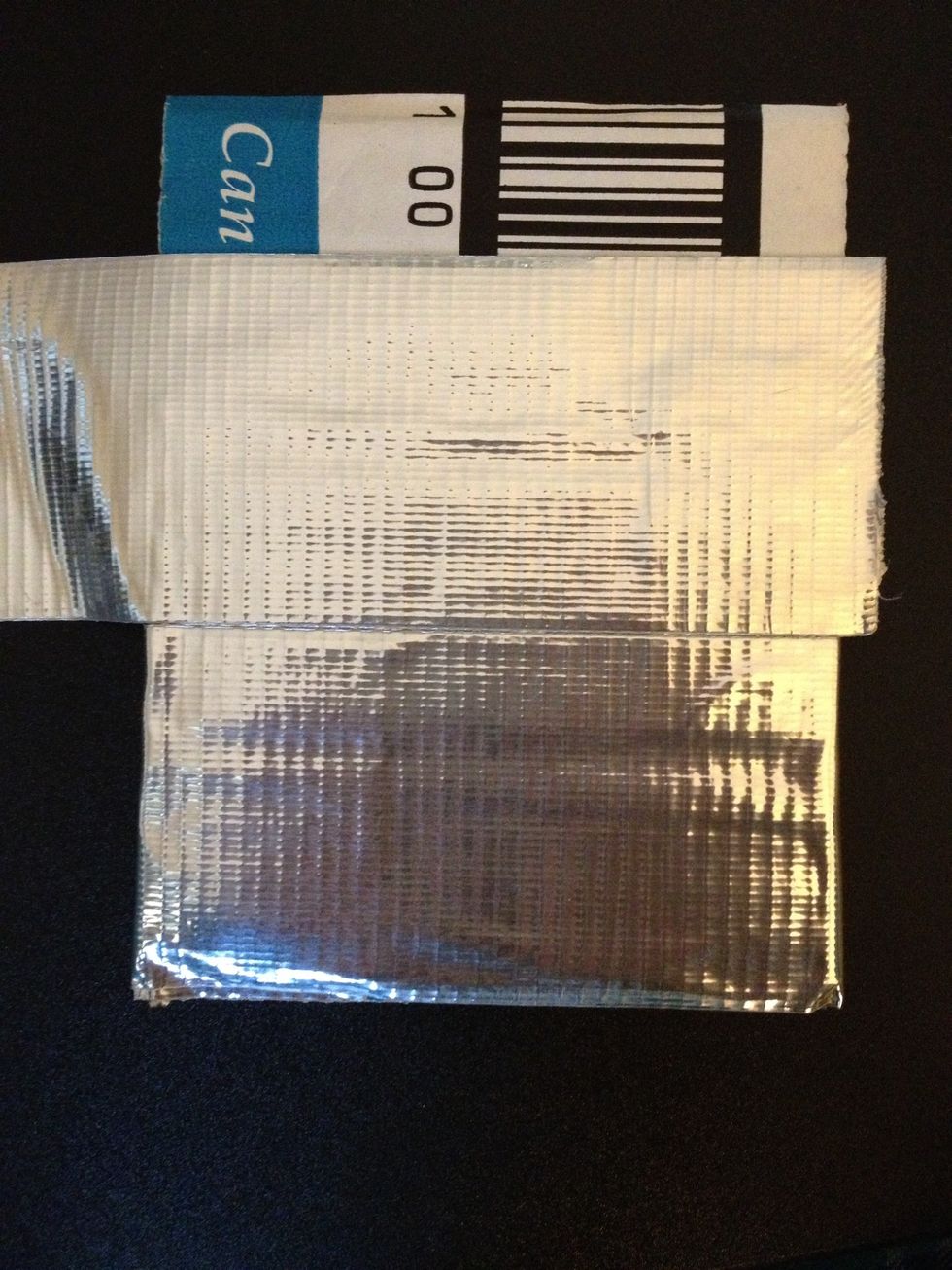 Cut another piece of tape the same length and line it up with the top edge of the last piece.