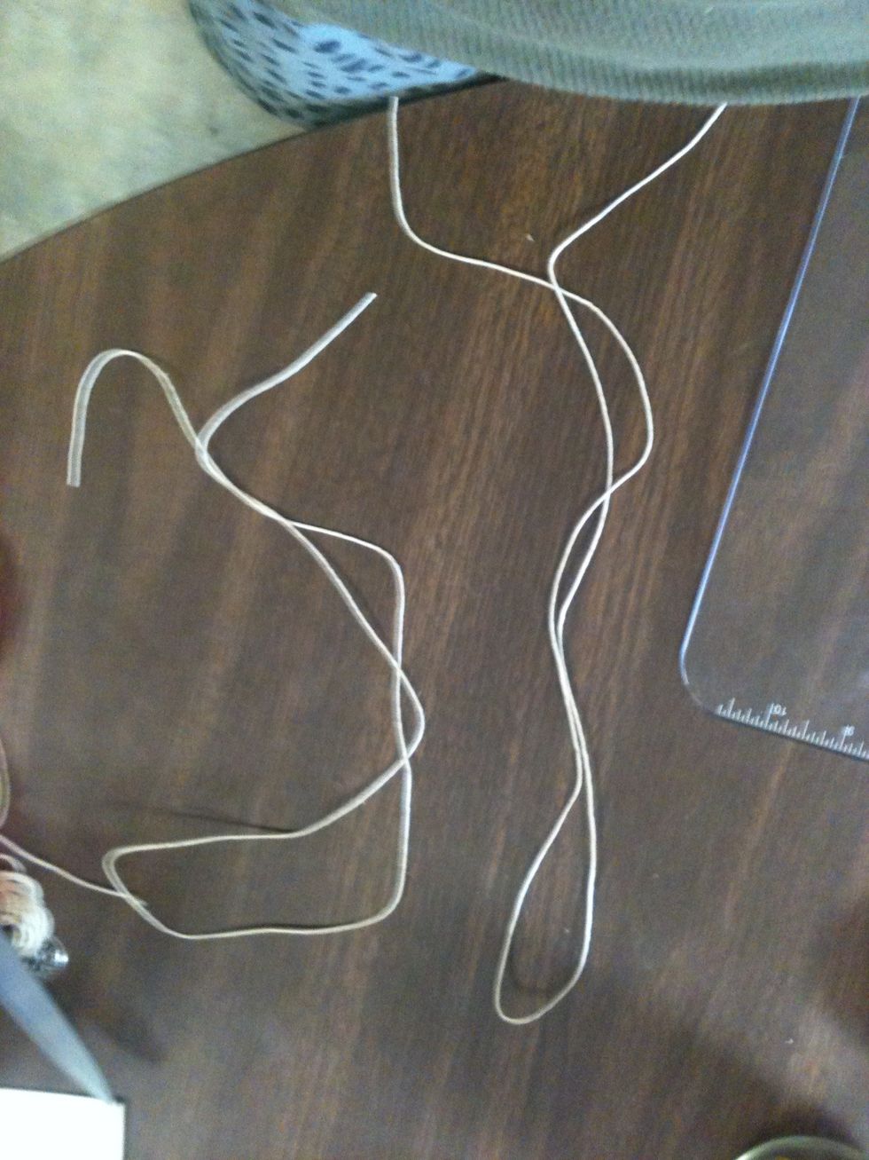Cut another string the same length.