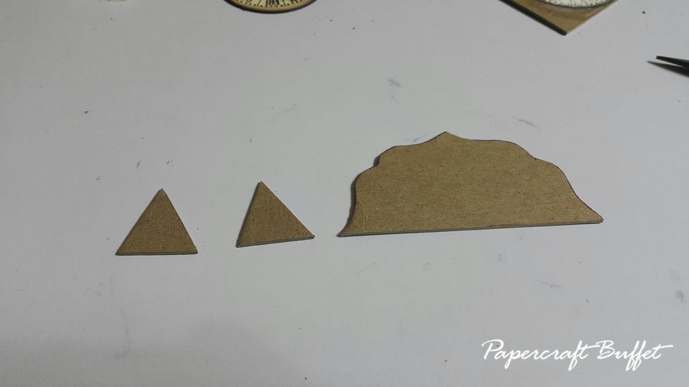 Cut another two small pieces of chipboard in triangle shape.