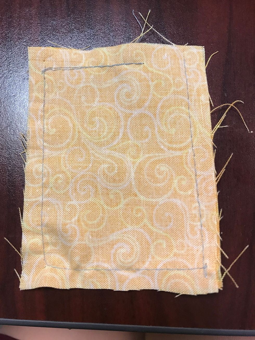 Cut any excess fabric from the corners and flip inside out, you can use a pen or pencil to help form the corners.