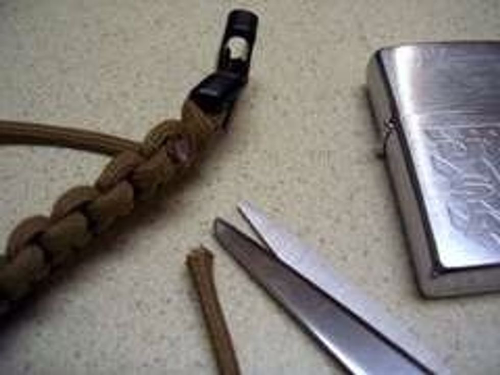 Cut any loose ends off and melt the ends, taking care not to burn the rest of the bracelet.