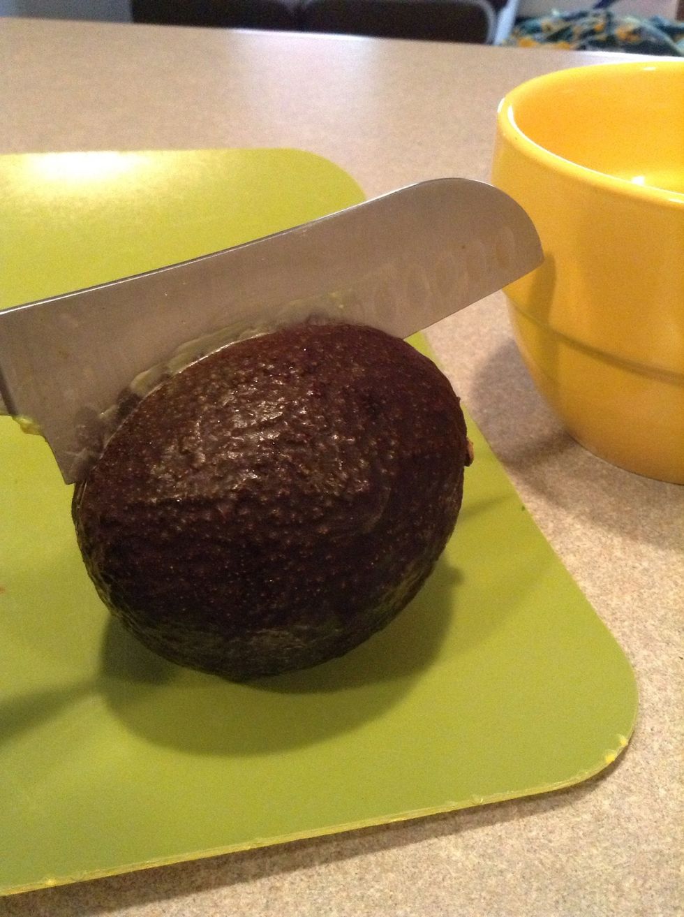 Cut around Avocado seed. Hold both sides with hands and twist to separate.