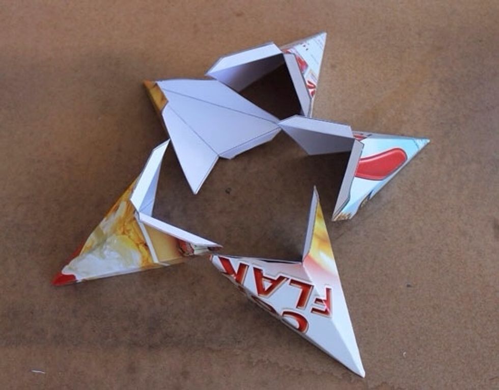 Cut around the borders of your templates. Now fold the templates according to the marked out lines. Be sure to fold the outer edges back. These will be used to attach the star points together.