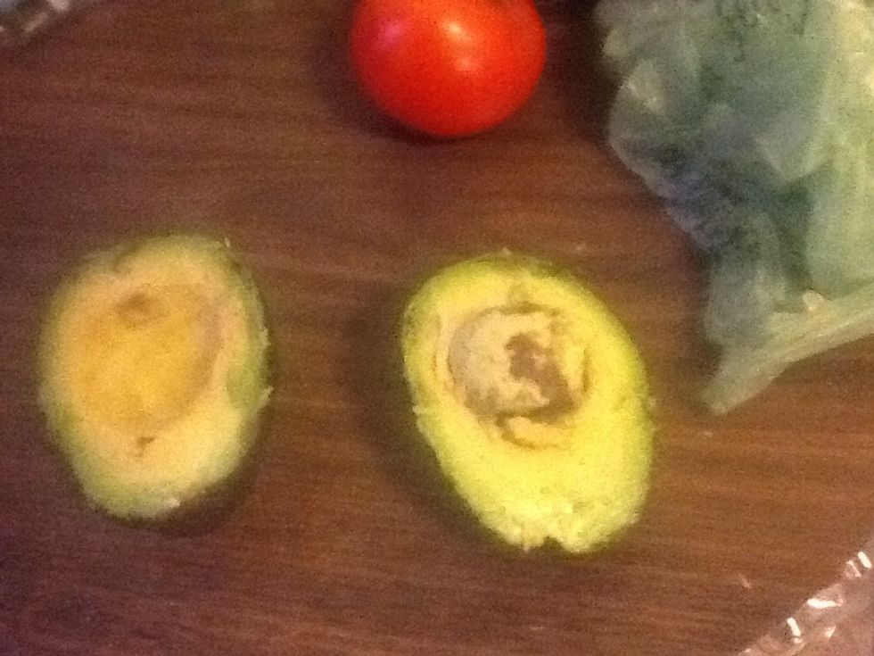 Cut avacado in half and remove seed