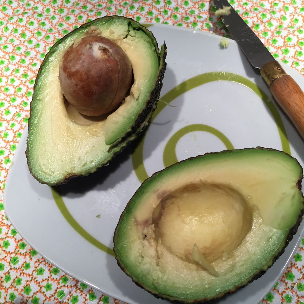 Cut avicado in halves
