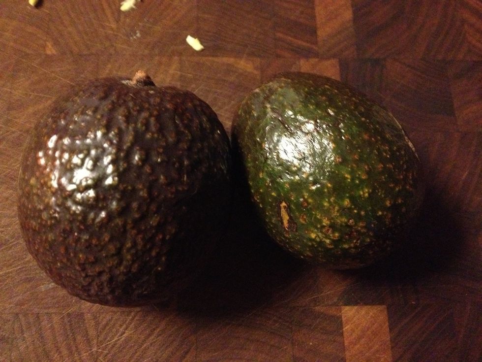 Cut avocados all the way around the pit and twist them in opposite directions to break apart.