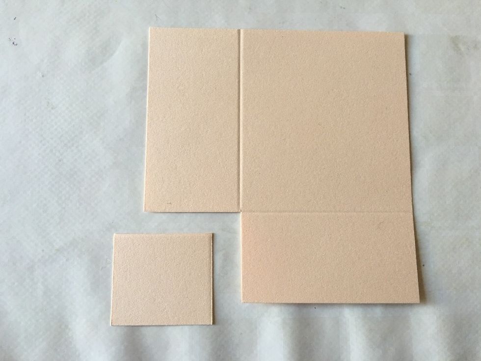 Cut away the smallest piece between the score lines.