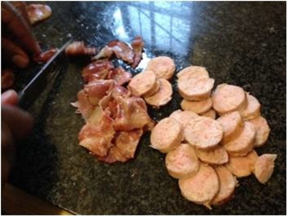Cut bacon into smaller strips and sausage into rings