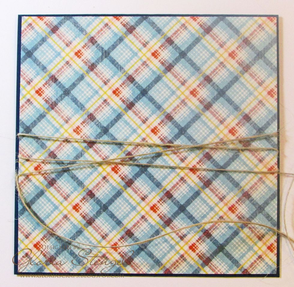 Cut blue cardstock to 5 x 10 inches. Score at 5 inches to make a top-fold, 5x5-inch card.  Cut the By the Sea Signature paper (reverse) to 4 7/8 x 4 7/8 inches.