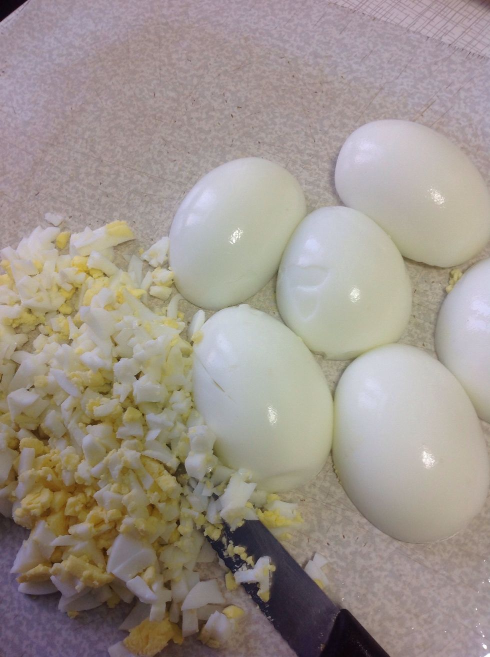 Cut boiled eggs into smaller cubes