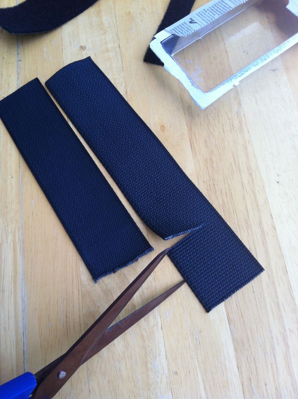 Cut both extra pieces to the mark and stick the remaining fuzzy Velcro on one end of each piece.