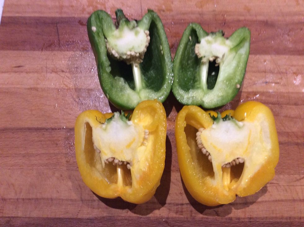 Cut both of your capsicums in half, then scoop the seeds into one of your bowls.