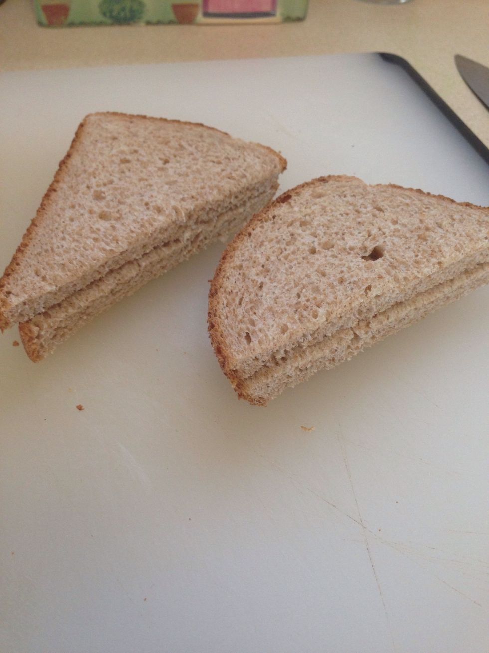 Cut bread slices in triangles