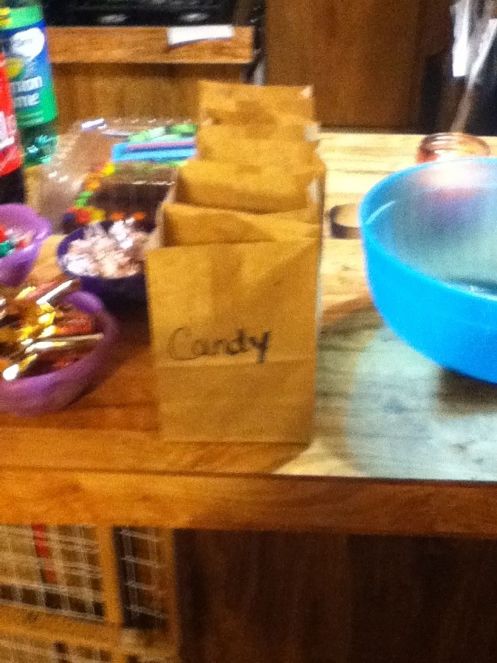 Cut brown paper bags in half then label candy