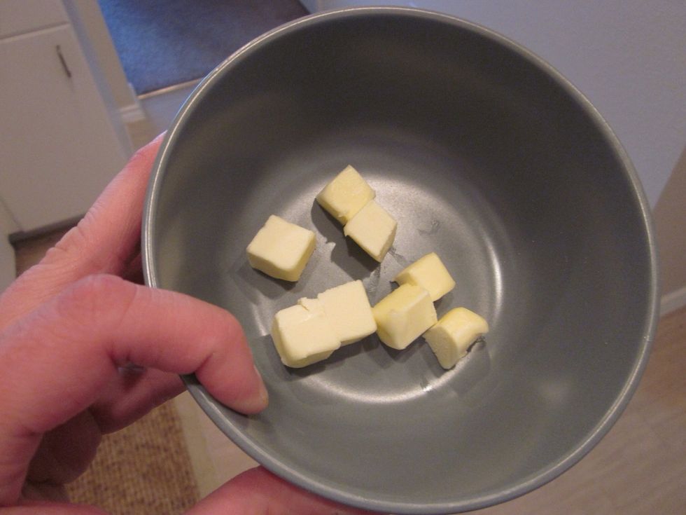 Cut butter into cubes. Melt in microwave, 45 seconds should do it. To be fair you could cut them in triangles or hexagons too, but really, how much time do you want to spend cutting butter?