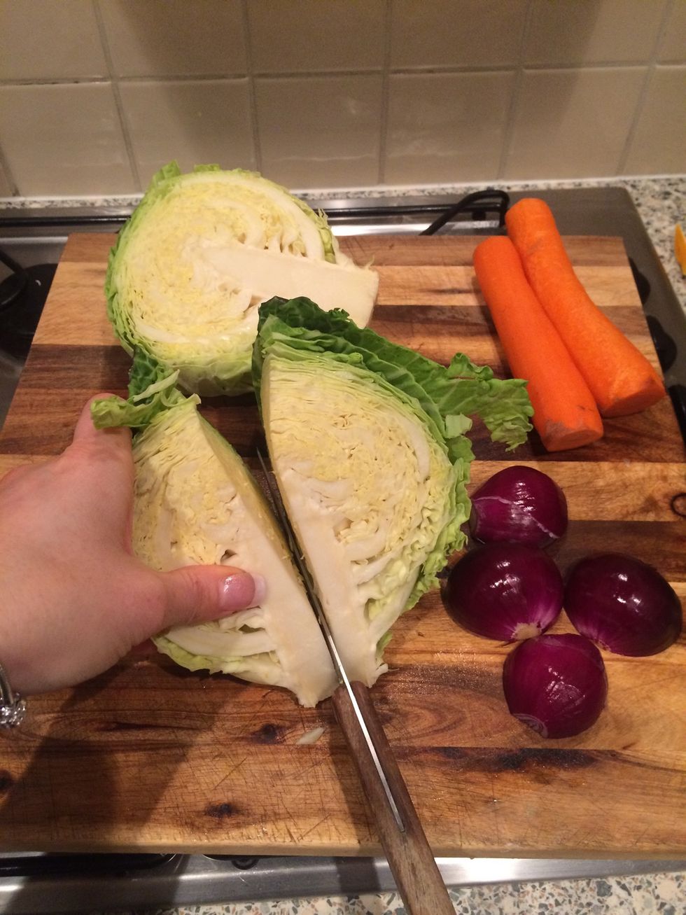 Cut cabbage in quarters