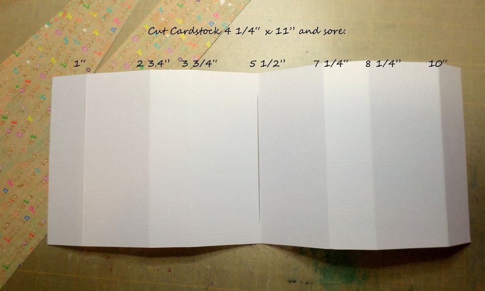 Cut cardstock 4 1/4" x 11".  Score the paper as shown in the picture.