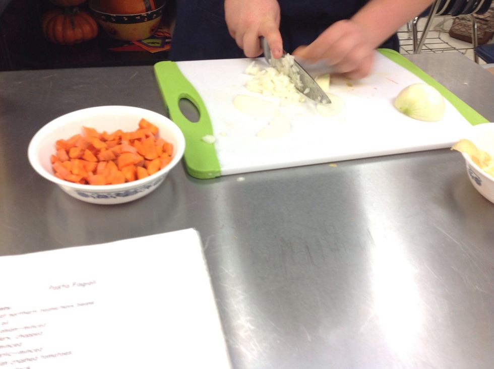 Cut carrots and onion.