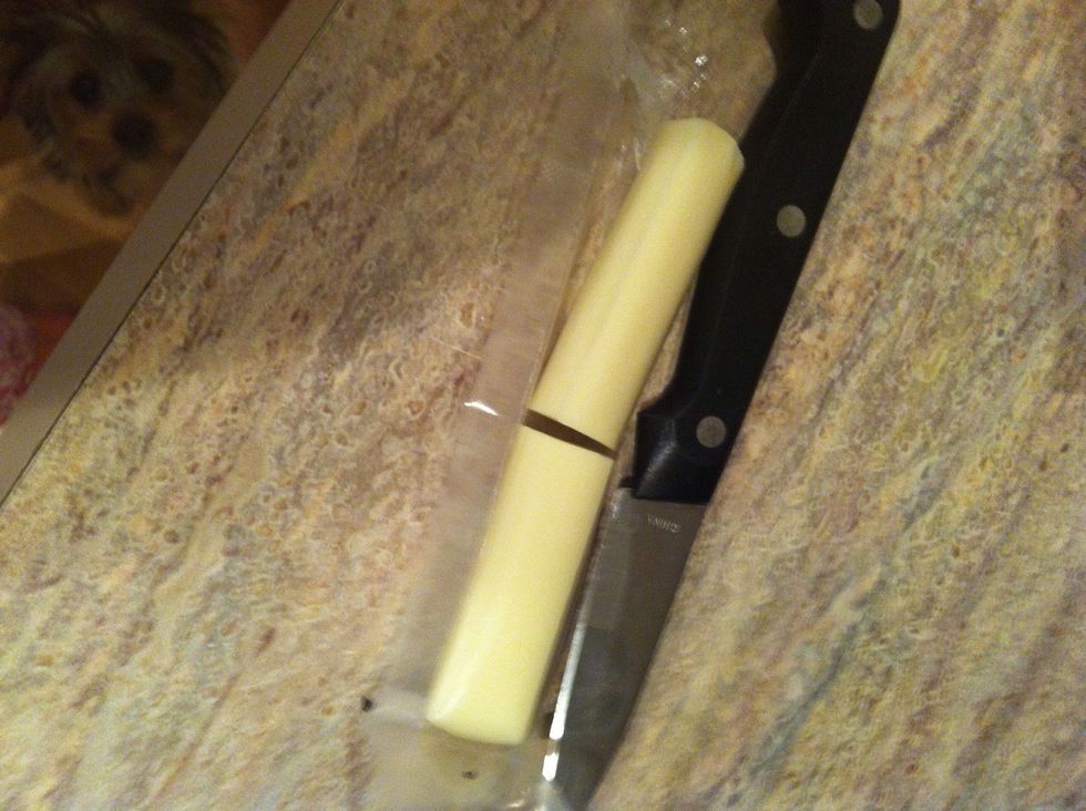 Cut cheese stick in half