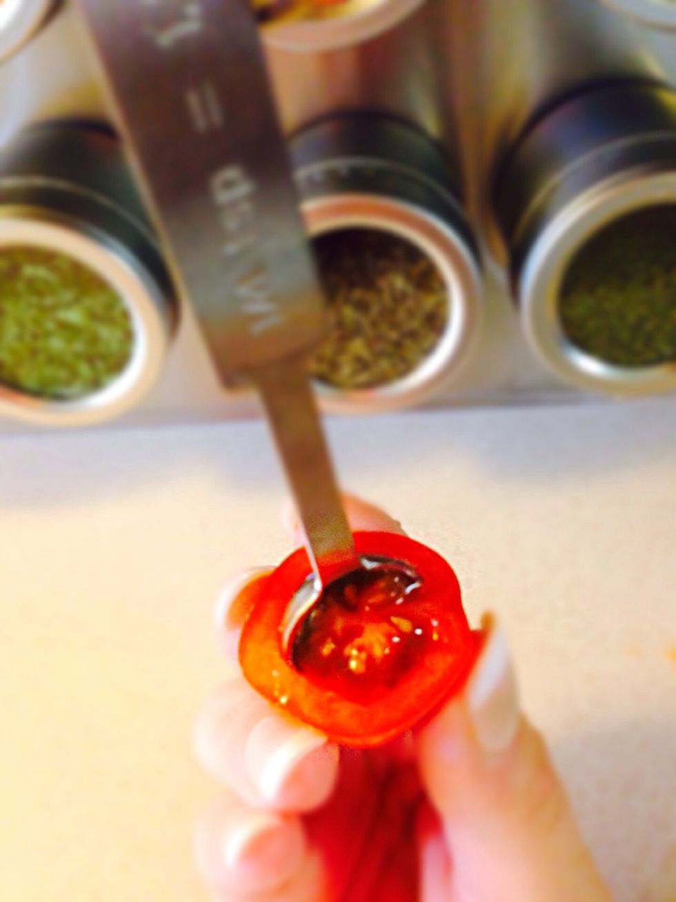 Cut cherry tomato in half and scoop the seeds out (it will be fisherman's hat) you'll see in a sec