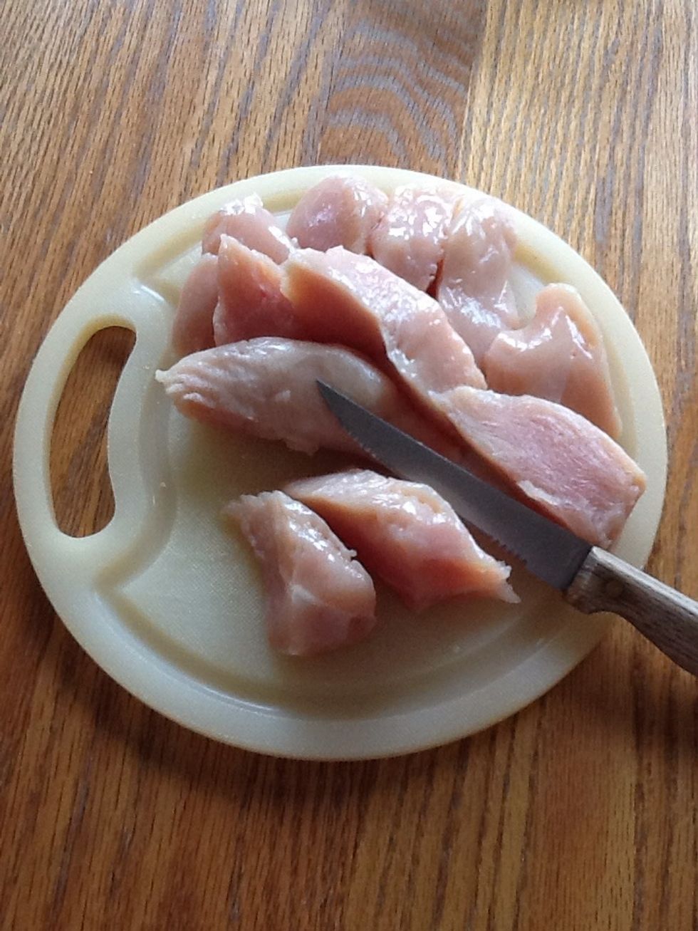 Cut chicken breasts into smaller chunks.