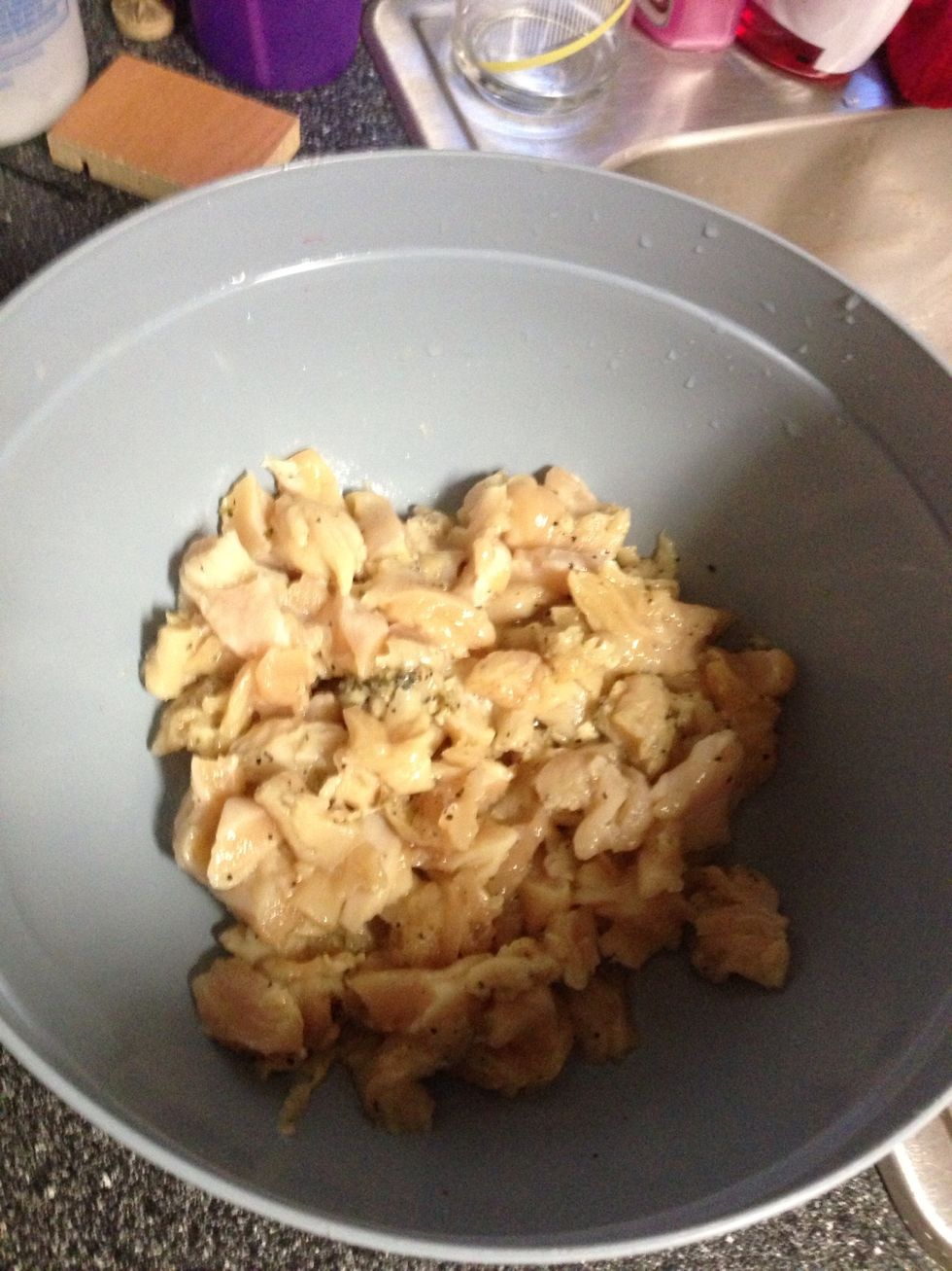 Cut chicken into bite size pieces. It's easy to do with kitchen scissors.