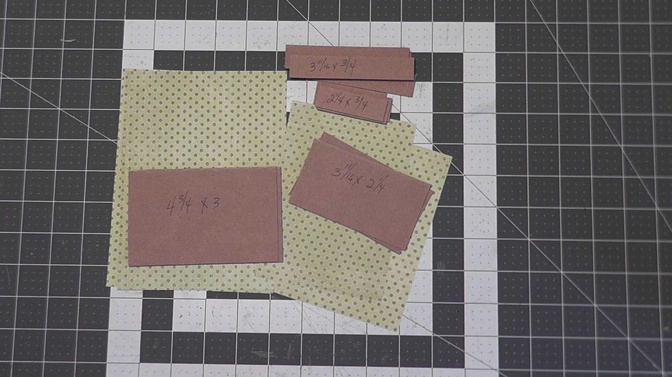 Cut chipboard:  2 each@ 4 3/4" x 3", 2 each 3 11/16" x 2 1/4", 4 each 3 11/16" x 3/4" and 4 each 2 1/4" x 3/4" .  Also cut your patterned paper:  2 each 7" x 5 1/4" and 2 each 4" x 5 3/4 each.