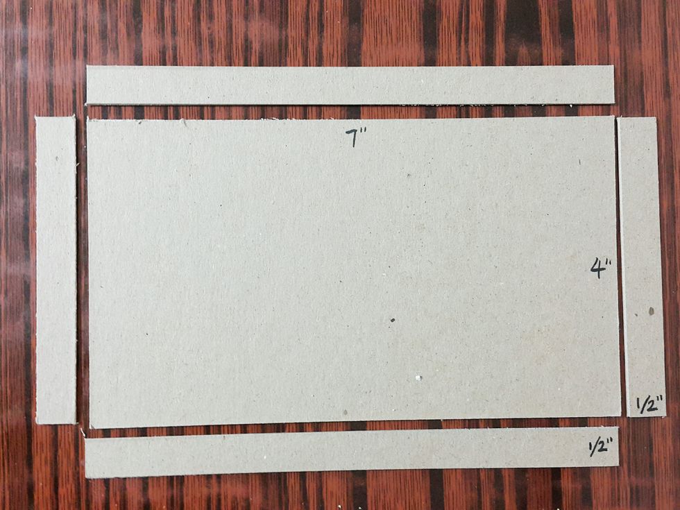 Cut chipboard of measurements as shown for the shop base.