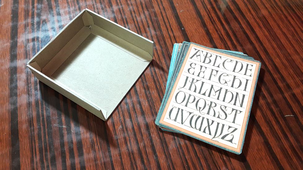 Cut chipboard pieces and adhere into shape which fit for the 3x4inch cards to slide in