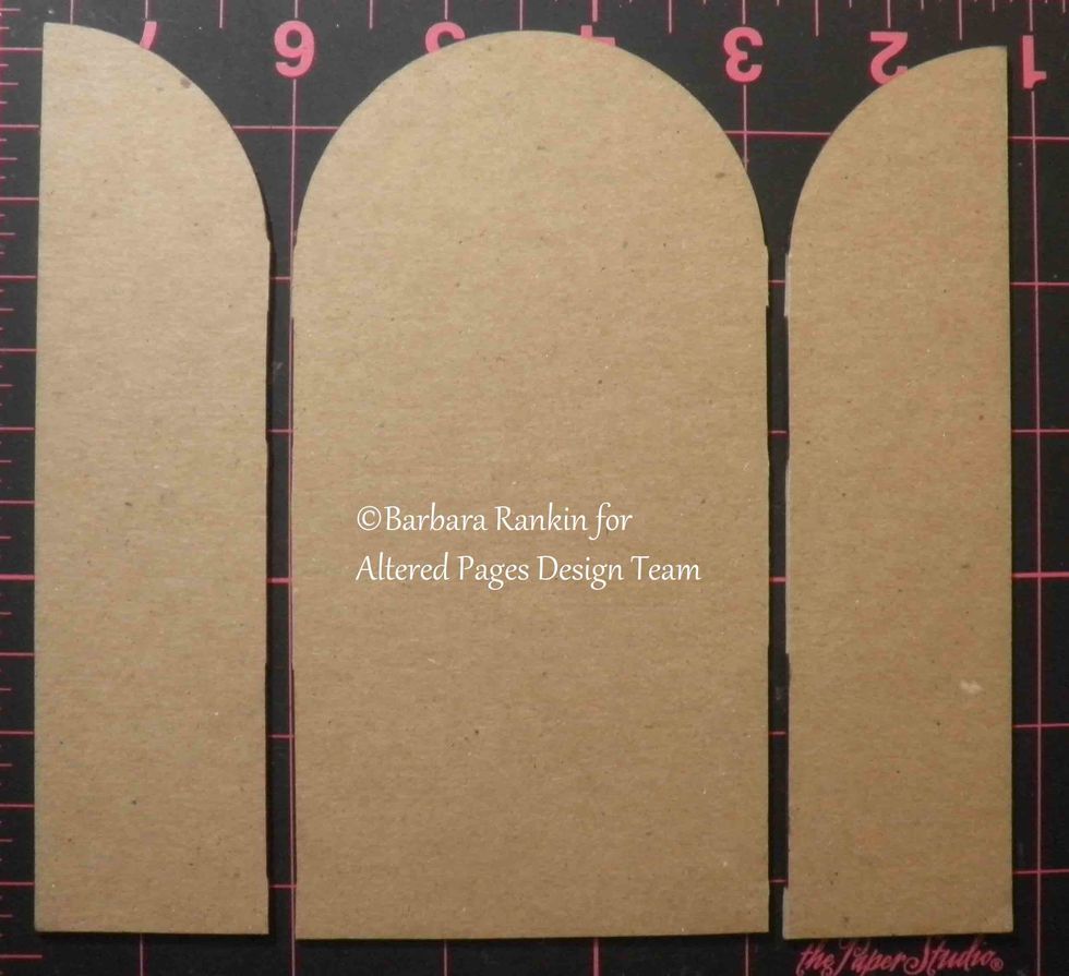 Cut chipboard shrine apart at the seam lines. Use center piece as a template to cut six pages from black card stock, set aside.