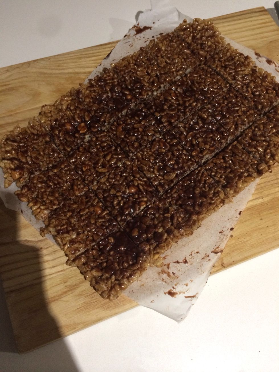 Cut chocolate rice treats into squares.