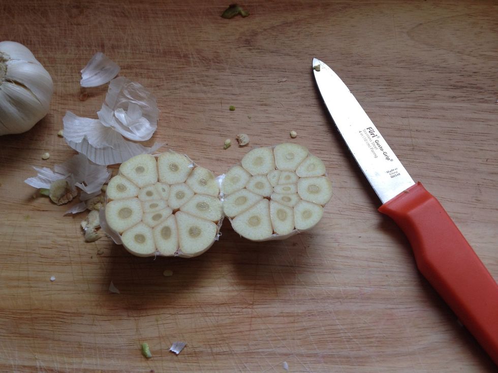 Cut clove in half. Don't worry if it comes apart, foil will hold it all together later