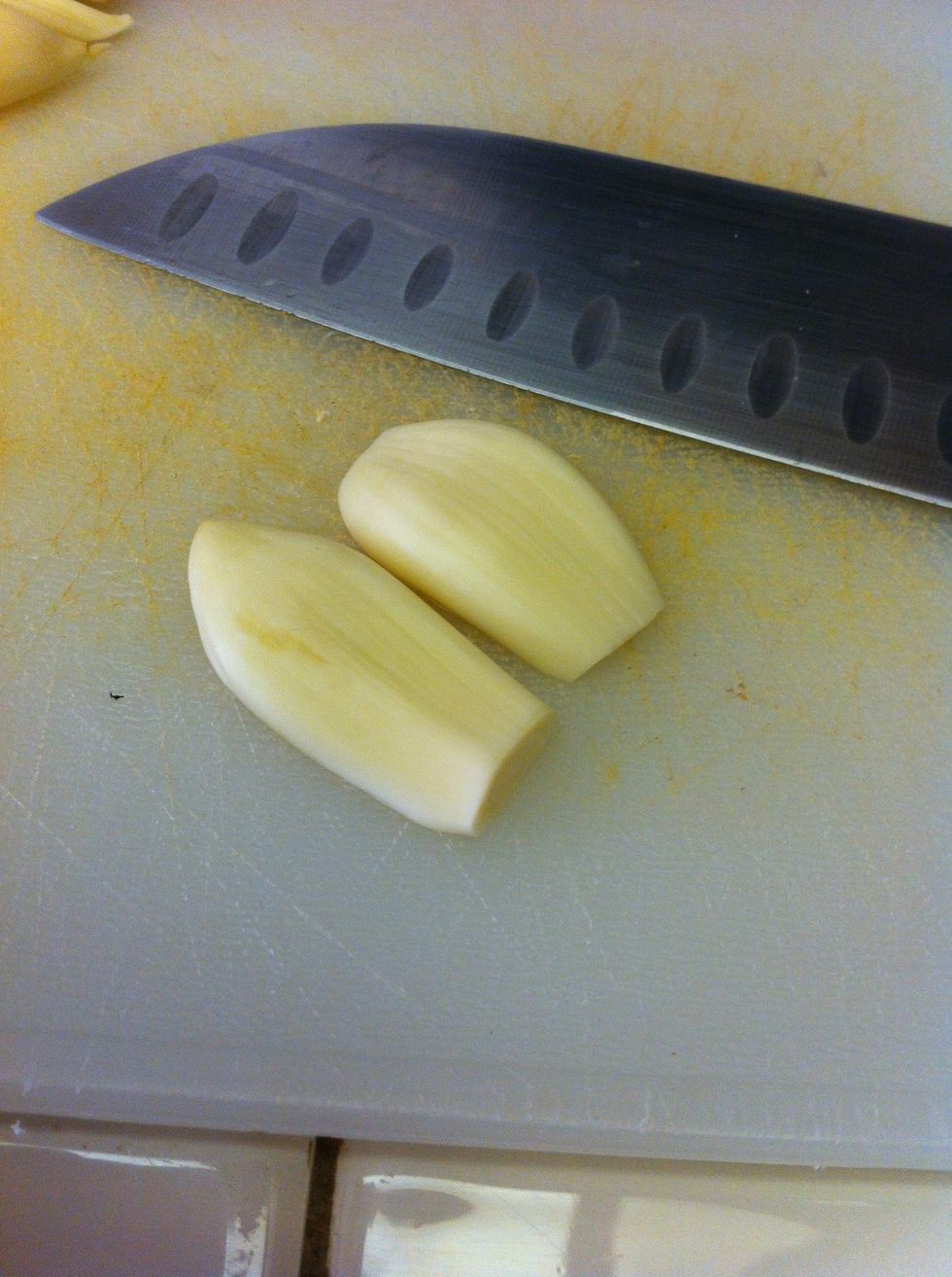 Cut clove in half lengthwise