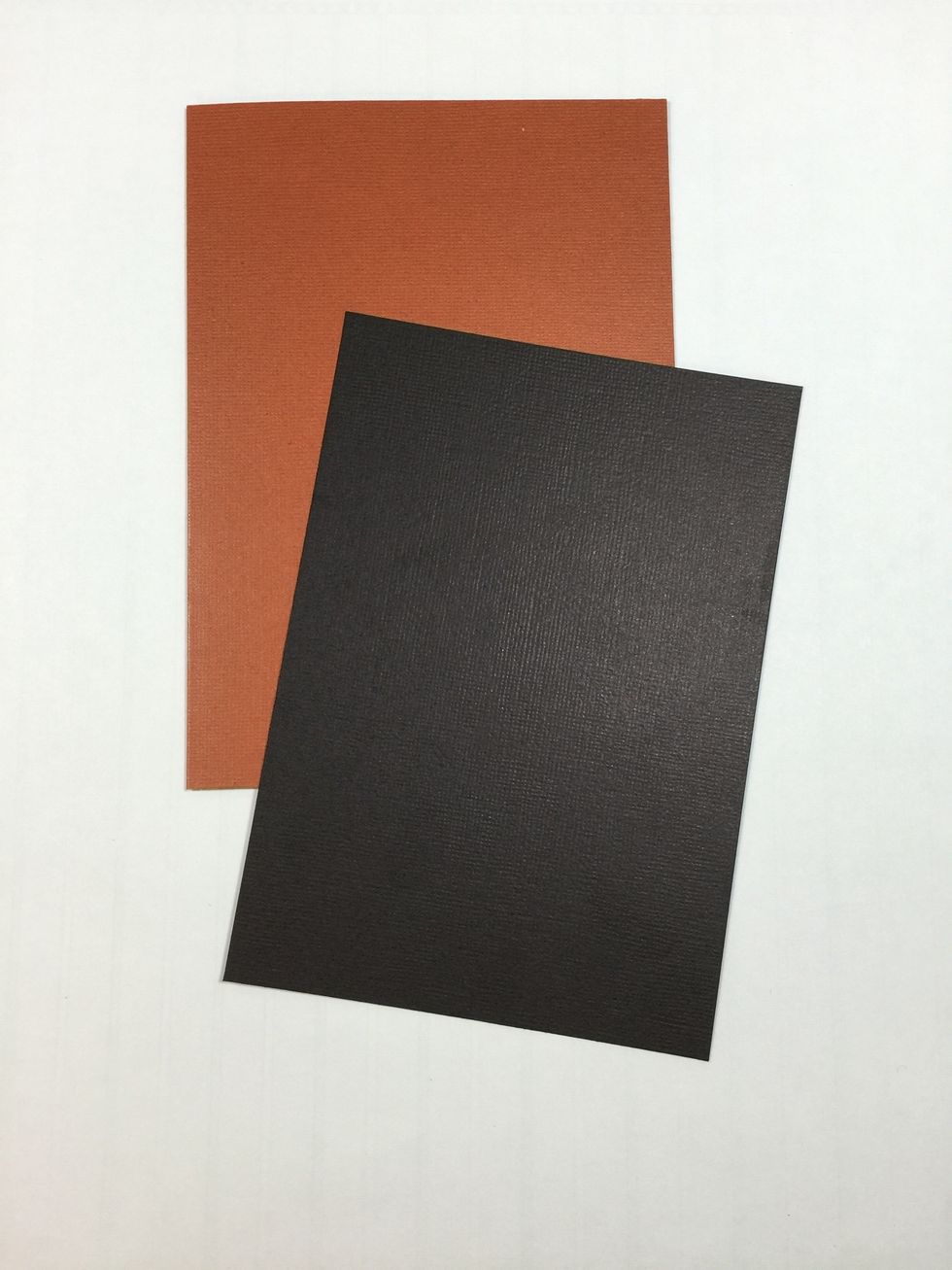 Cut deep orange cardstock to make a 5" x 7" card base. Then cut black cardstock 4 3/4" x 6 3/4". Adhere the black to the card base.
