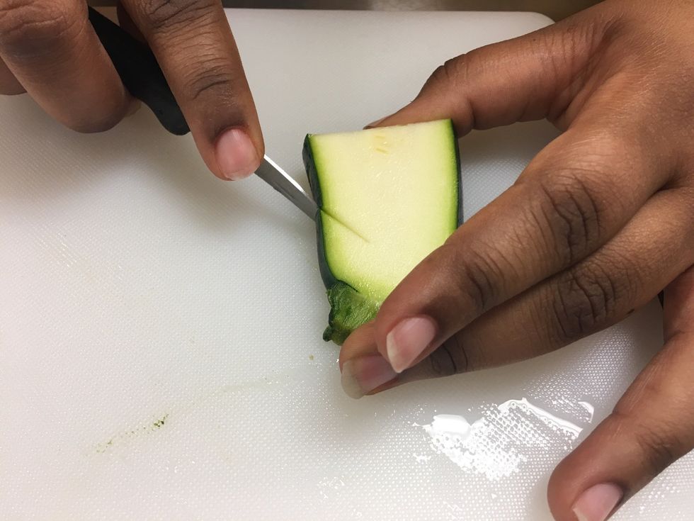 Cut diagonally just a little line to start off the head.