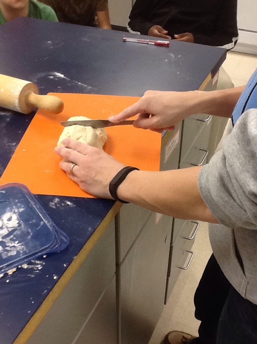 Cut dough in half