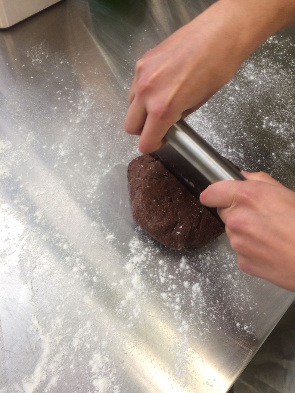 cut dough into quarters. remove one and cover the other 3 to prevent it from drying out.