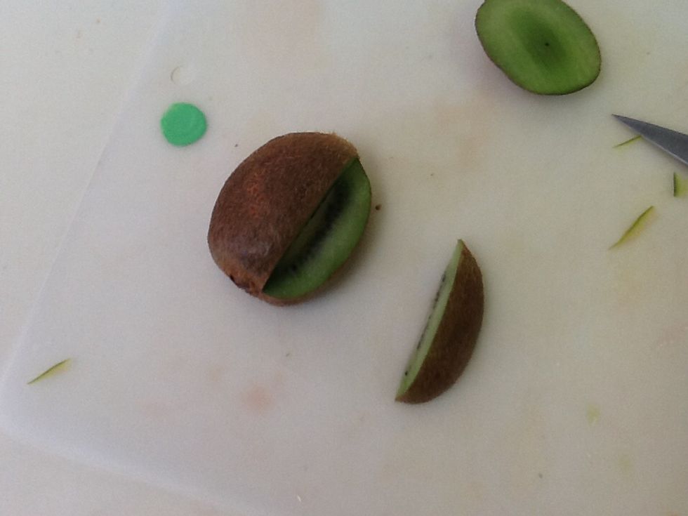 Cut down beside the center to the center. Then cut horizontally to the other cut.