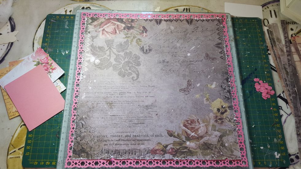 Cut down the pattered 'Timeless' paper to fit inside the punched border on the cardstock and distress the edges. Stick into place.