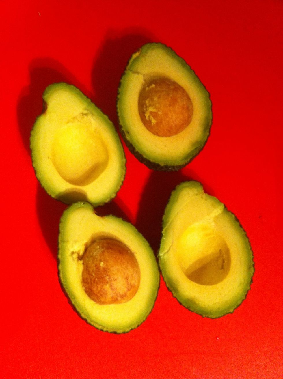 Cut each avocado in half