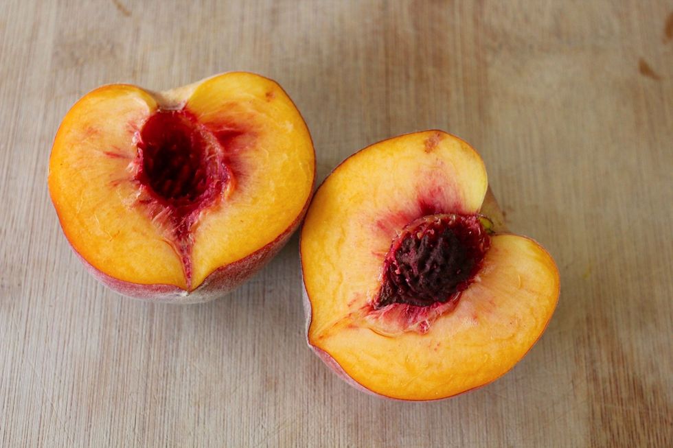 Cut each peach in half and remove the pit.